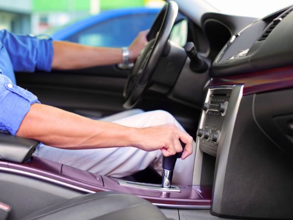 Driver's hand on automatic gear shift